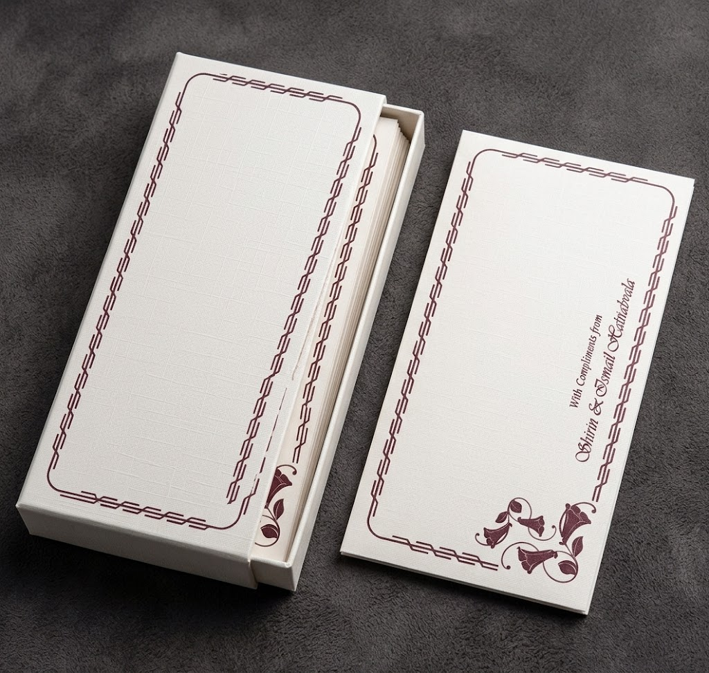 Boxed set of ivory currency envelopes with a maroon border and the hosts names printed in script