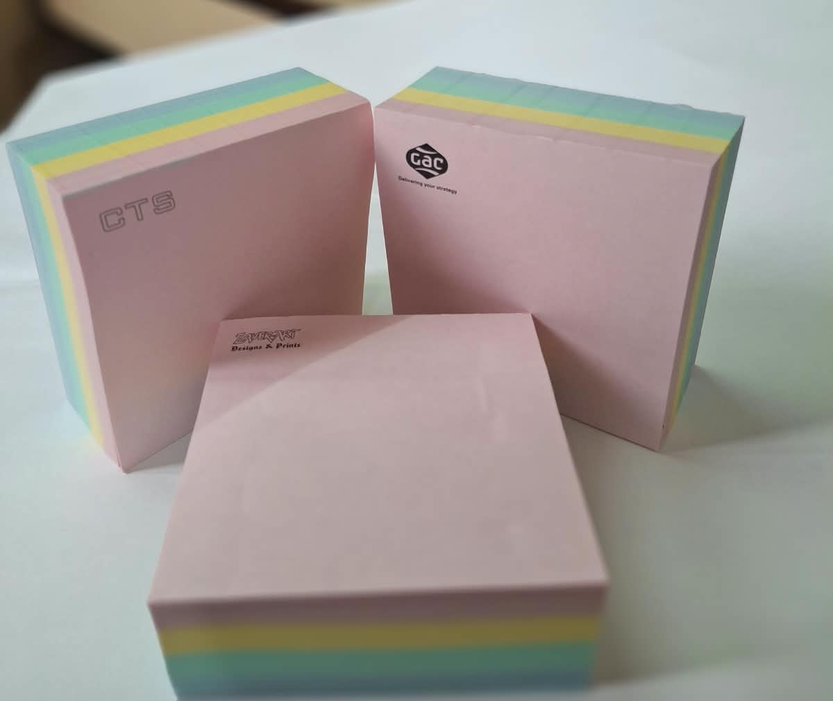 Custom-branded memo pads in pastel stock